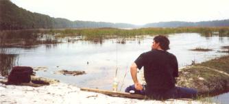 Here is a photo of John contemplating lunch by Oyster Pond on St. Vincent Island, Florida