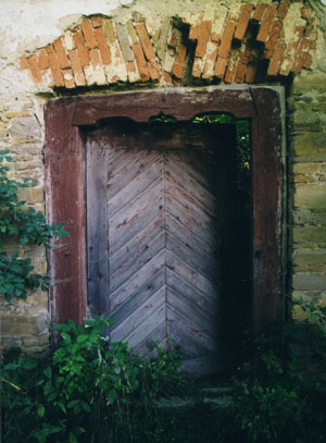 A photo of the door of the abandoned Łemko church in Nagórzany